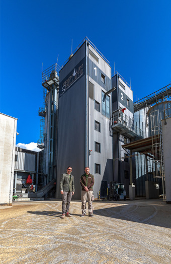 Bernhard Sturmberger and Tamas Engler in front of the two PELLET.TOWERs
