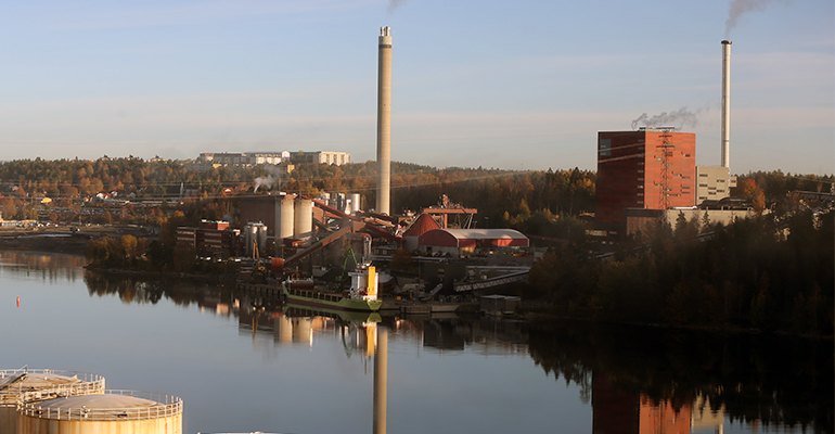 A vessel unloading biomass fuel at quayside.